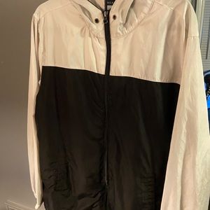 White and black zip up wind breaker